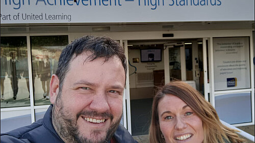Rich and Olivia outside school
