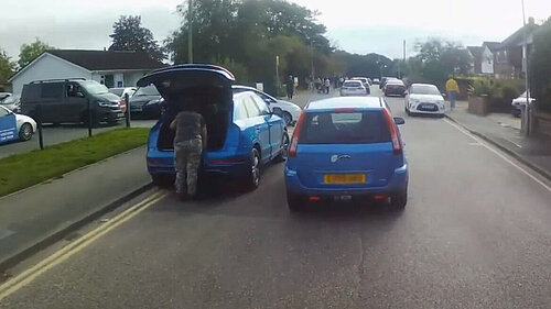 badly parked cars outside school